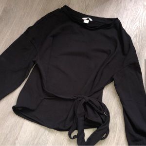 Cozy black sweater with side tie design